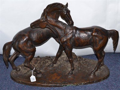 Lot 305 - A Bronze Group of Two Horses, after the model by Pierre Jules Mene, standing on an oval mound base