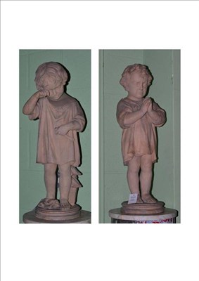 Lot 330 - A Pair of Terracotta Figures of Children, late 19th century, each standing wearing loose...