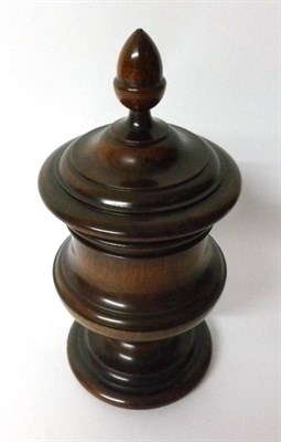 Lot 373 - A Lead Lined Turned Mahogany Goblet and Cover, 19th century, the domed cover with acorn finial over