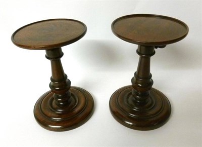 Lot 374 - A Pair of Turned Mahogany Adjustable Stands, 19th century, the circular tops on turned baluster...