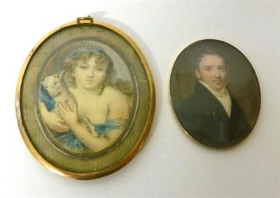 Lot 384 - English School, circa 1830: A Portrait Miniature of a Young Woman, plaited brown hair and blue...