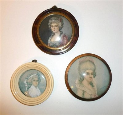 Lot 385 - Three Decorative Miniatures, circa 1900, all of ladies with elaborate powdered coiffures, one...