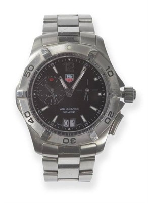 Lot 403 - A Stainless Steel Calendar Alarm Wristwatch, signed Tag Heuer, model: Aquaracer 300 meters,...