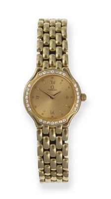 Lot 408 - A Lady's 18ct Gold Diamond Set Wristwatch, signed Omega, circa 1990, quartz movement, gilt dial...