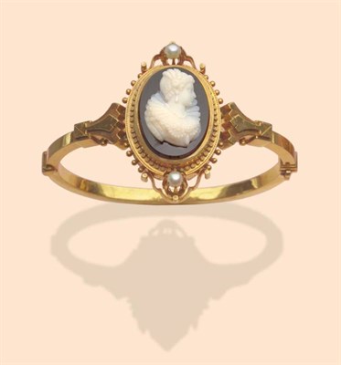 Lot 443 - A Hardstone Cameo Bangle, the cameo portrait depicts a lady adorned with jewellery, with a ruff...