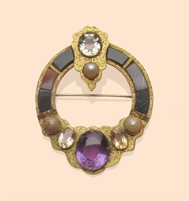 Lot 452 - A Scottish Brooch, the shaped hoop set with agate panels and cabochons and quartz stones, in an...