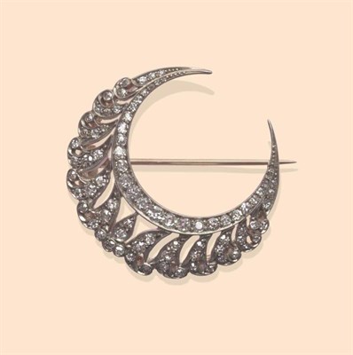 Lot 455 - A Late Victorian Diamond Crescent Brooch, set with old cut and single cut diamonds, in white...