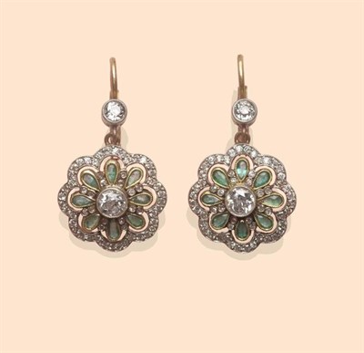 Lot 456 - A Pair of Emerald and Diamond Drop Earrings, an old cut diamond suspends a cluster of pear cut...