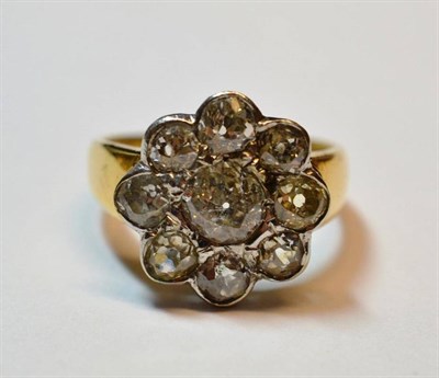 Lot 459 - A Diamond Cluster Ring, an old cut diamond within a border of eight smaller, in white rubbed...