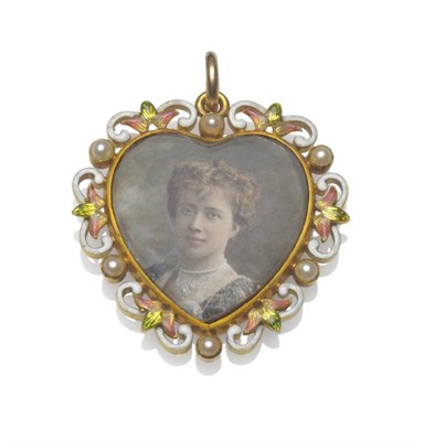 Lot 465 - An Early 20th Century Locket, the double sided heart shaped locket within a scrolling frame...