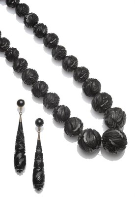 Lot 466 - A Jet Necklace, of graduated spherical beads, carved with leaf motifs, length 76cm...