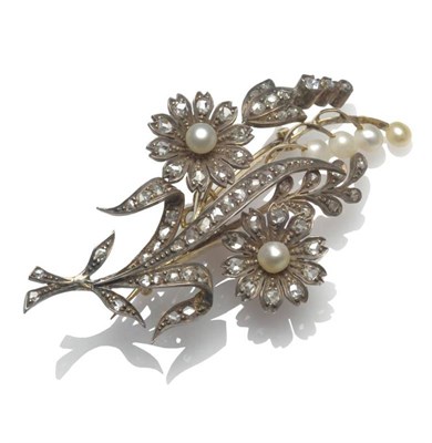 Lot 468 - A Late Victorian Diamond and Pearl Brooch, of floral spray form, two floral clusters centred by...