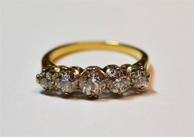 Lot 476 - A Five Stone Diamond Ring, the graduated old cut diamonds in white claw settings, to a yellow...