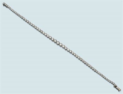 Lot 486 - A Diamond Line Bracelet, the graduated round brilliant cut diamonds in white millegrain...