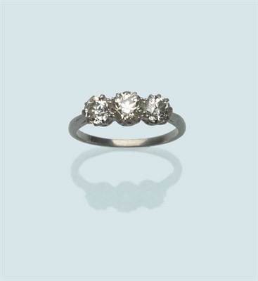 Lot 487 - A Diamond Three Stone Ring, the old cut diamonds in white claw settings, to a tapered shoulder...