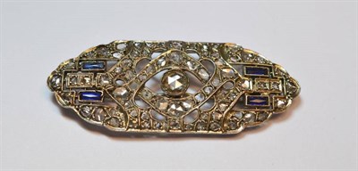 Lot 493 - A Diamond and Sapphire Plaque Brooch, a rose cut diamond centrally, within a pierced and...