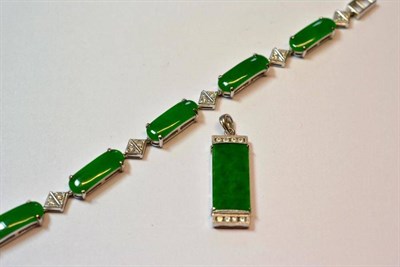 Lot 508 - A Jade and Diamond Bracelet, curved oblong jade panels in white claw settings spaced by squared...