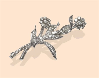 Lot 510 - A Diamond Floral Spray Brooch, set throughout with brilliant cut, single cut and baguette cut...