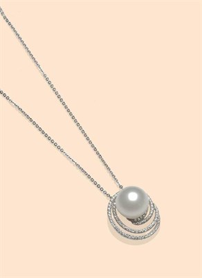 Lot 511 - An 18 Carat White Gold Cultured South Sea Pearl and Diamond Pendant, the pearl set within a...