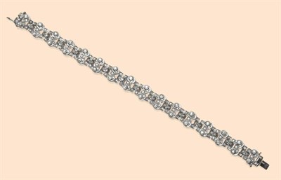 Lot 516 - A Diamond Bracelet, the fancy links articulated, and set throughout with old cut and single cut...