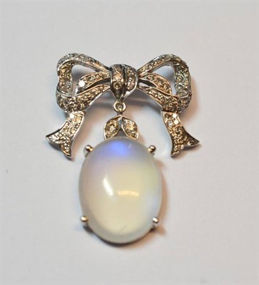 Lot 522 - An 18 Carat White Gold Moonstone and Diamond Pendant, a bow motif set with round brilliant cut...