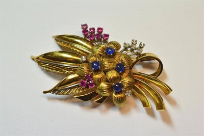 Lot 526 - A Gem Set Floral Spray Brooch, polished and textured white and yellow gold creates the flower...