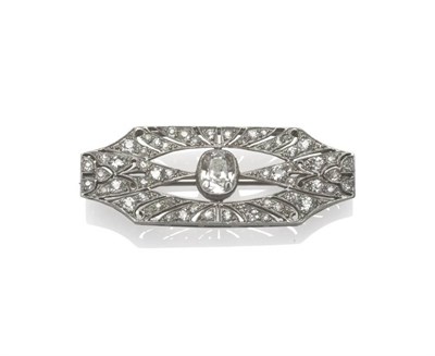 Lot 536 - A Diamond Plaque Brooch, an old cut diamond centrally, within a pierced geometric frame, set...