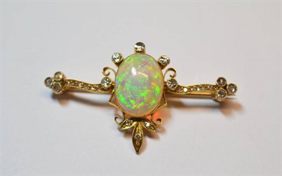 Lot 538 - An Opal and Diamond Brooch, an oval cabochon opal within a frame and bar set with single cut...