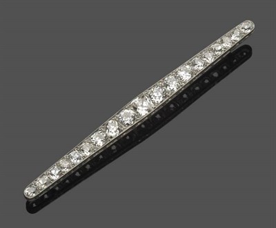 Lot 544 - A Diamond Bar Brooch, circa 1930, nineteen old cut diamonds graduate along the bar, in white...