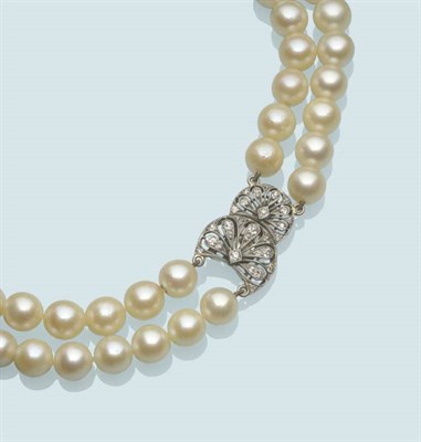 Lot 555 - A Cultured Pearl Choker, the two rows of 47:51 pearls strung to an Art Deco split clasp, of two...