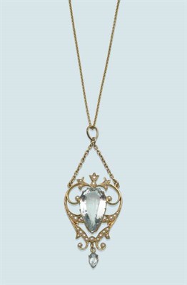 Lot 556 - An Early 20th Century Aquamarine and Seed Pearl Pendant, the openwork pendant with a pear cut...