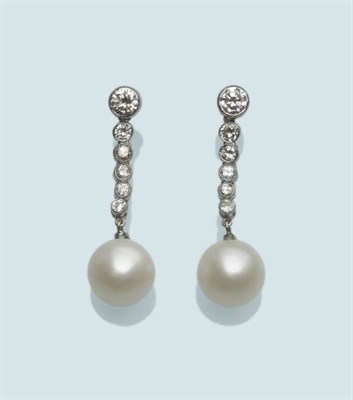 Lot 559 - A Pair of Diamond and Cultured Pearl Earrings, a string of round brilliant cut diamonds in...