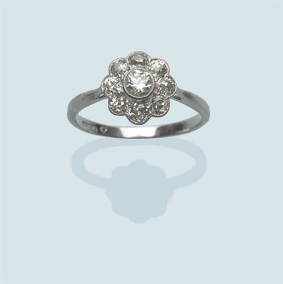 Lot 564 - A Diamond Cluster Ring, circa 1930, an old cut diamond centrally within a border of eight...