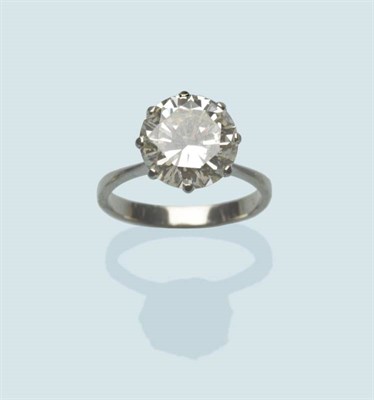 Lot 565 - A Diamond Solitaire Ring, the round brilliant cut diamond in a white eight claw setting, to a...