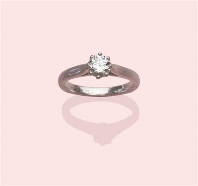 Lot 573 - A Platinum Diamond Solitaire Ring, the round brilliant cut diamond in an eight claw setting, to...