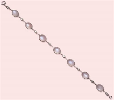 Lot 584 - A Moonstone and Diamond Bracelet, oval cabochon moonstones in white milled edge bezel settings,...