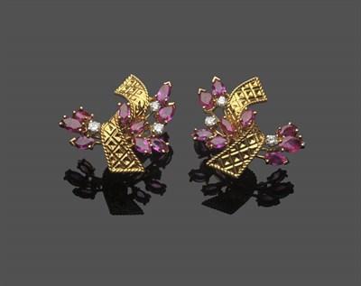 Lot 592 - A Pair of Ruby and Diamond Earrings, each set with marquise cut rubies and round brilliant cut...