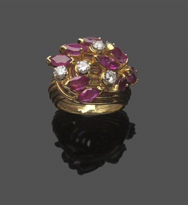 Lot 594 - An 18 Carat Gold Ruby and Diamond Cocktail Ring, by Kutchinsky, nine marquise cut rubies and...