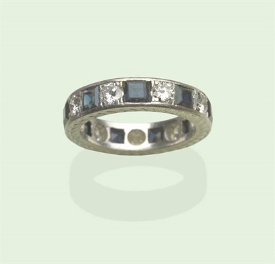 Lot 604 - A Sapphire and Diamond Full Eternity Ring, alternating round brilliant cut diamonds and square step