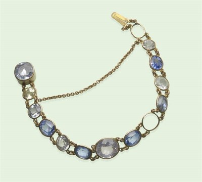 Lot 611 - A Sapphire Bracelet, by Child and Child, circa 1890-1899, assorted blue, yellow, white and a...