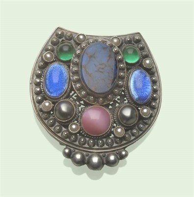 Lot 613 - An Arts and Crafts Buckle, set with foil backed and paste stones, in a beaded decorated frame,...