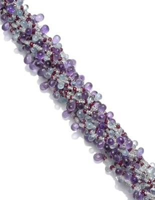 Lot 623 - An Amethyst, Aquamarine and Ruby Necklace, comprising multiple strands of faceted beads, with...