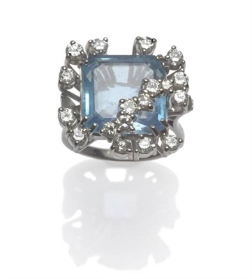 Lot 624 - An Aquamarine and Diamond Cluster Ring, circa 1970, the square step cut aquamarine with...