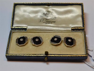 Lot 631 - A Pair of Cufflinks, with bar linked octagonal heads, set centrally with a brilliant cut diamond in