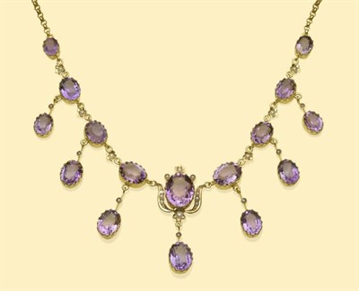 Lot 633 - An Amethyst and Seed Pearl Fringe Necklace, the oval cut amethysts in yellow claw settings,...