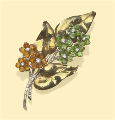 Lot 638 - A Floral Spray Brooch, five clusters of demantoid garnets as flowers and three of citrines,...