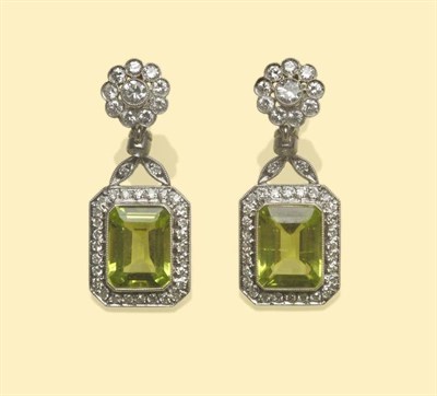 Lot 643 - A Pair of Peridot and Diamond Drop Earrings, a floral cluster of round brilliant cut diamonds...