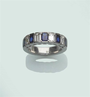 Lot 654 - A Diamond and Sapphire Half Eternity Ring, five scissor cut sapphires alternate with four...