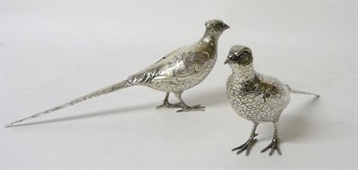 Lot 668 - A Pair of White Metal Pheasant Table Ornaments, 20th century, each standing with naturalistic...