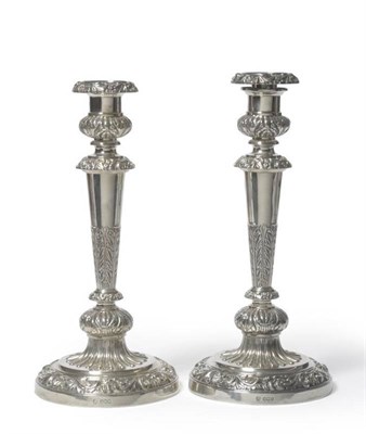 Lot 674 - A Pair of George V Silver Candlesticks, Hawksworth, Eyre & Co Ltd, Sheffield 1927, the nozzles...